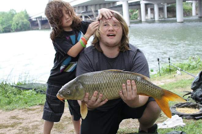 Hendrix giving Phoenix Van Auken a helping hand with his hair while posing with his 11.0 lb common